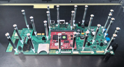 Printed Circuit Board (PCB) that has been contacted for in-circuit testing (ICT)